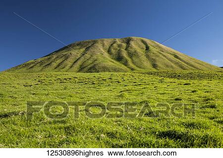 Stock Photograph - Cinder cone (Pu'u) in a cattle pasture, Kahua Ranch, North Kohala Mountains; Island of Hawaii, Hawaii, United States of America. Fotosearch