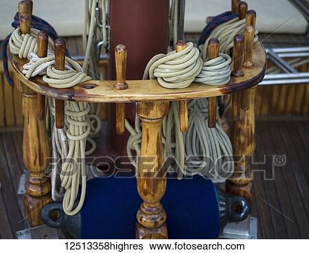 Stock Photograph - Close-up of bundled ropes on the deck of a sailboat; Monte. Fotosearch