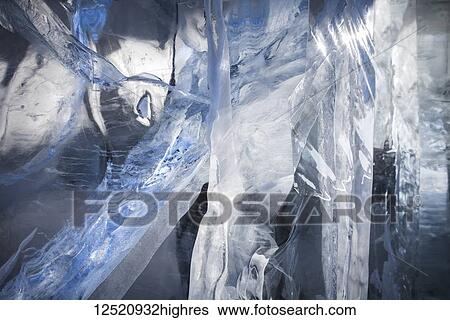 Stock Photograph - Close-up of cracks in a block of ice; Winnipeg, Manitoba, Canada. Fotosearch