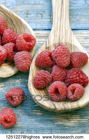 Close-up of fresh, red raspberries in a wooden spoon View Large Photo Image Stock Photograph - Close-up of fresh, red raspberries in a wooden spoon. Fotosearch