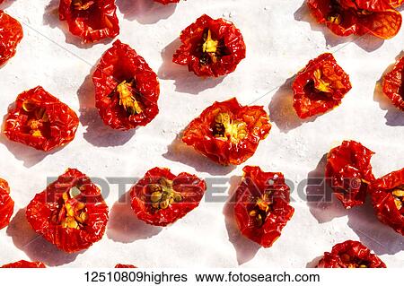 Stock Photograph - Close-up of halved sun dried cherry tomatoes. Fotosearch