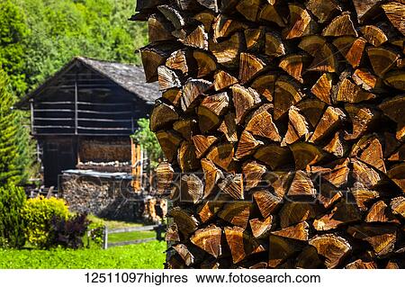 Close-up of stacked firewood and historic wooden buildings at village of Praz de Fort; Praz de Fort, Val Ferret, Switzerland View Large Photo Image Stock Photograph - Close-up of stacked firewood and historic wooden buildings at village of Praz de Fort; Praz de Fort, Val Ferret, Switzerland. Fotosearch