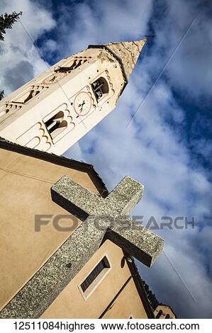 Close-up of stone cross and Church of St. Panteleimon under blue sky; Courmayeur, Aosta Valley, Italy View Large Photo Image Stock Photograph - Close-up of stone cross and Church of St. Panteleimon under blue sky; Courmayeur, Aosta Valley, Italy. Fotosearch