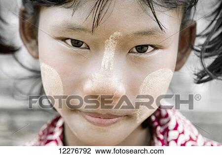 Close up portrait of a young girl with white face paint; Bagan, Myanmar View Large Photo Image Stock Image - Close up portrait of a young girl with white face paint; Bagan, Myanmar. Fotosearch
