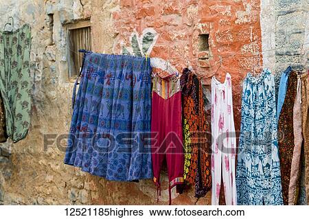 Stock Photograph - Clothing hanging on a clothesline, Jaisalmer Fort; Jaisalmer, Rajasthan, India. Fotosearch