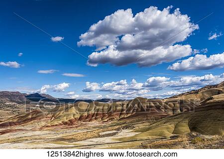 Clouds float above the Painted Hills Unit of John Day Fossil Beds National Monument; Mitchell, Oregon, United States of America View Large Photo Image Stock Photograph - Clouds float above the Painted Hills Unit of John Day Fossil Beds National Monument; Mitchell, Oregon, United States of America. Fotosearch