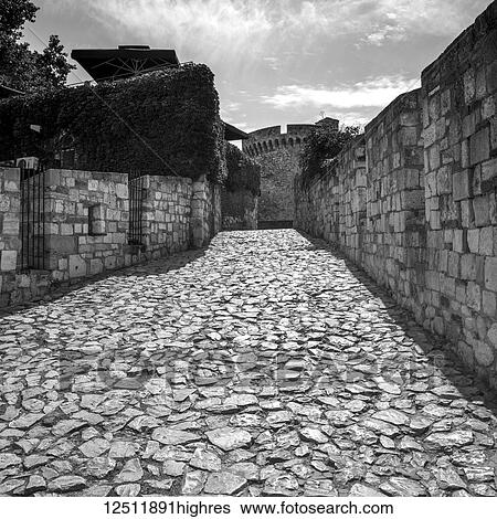 Stock Photograph - Cobblestone walkway at the Belgrade Fortress; Belgrade, Vojvodina, Serbia. Fotosearch