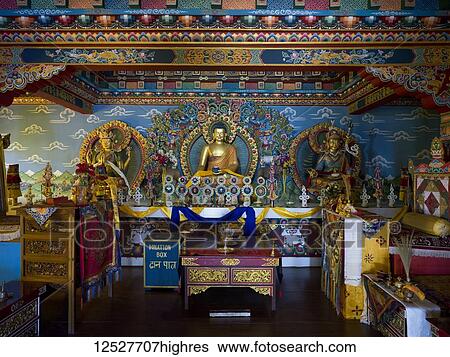 Stock Photograph - Colourful interior of a Buddhist shrine with a donation box; Kaluk, Sikkim, India. Fotosearch