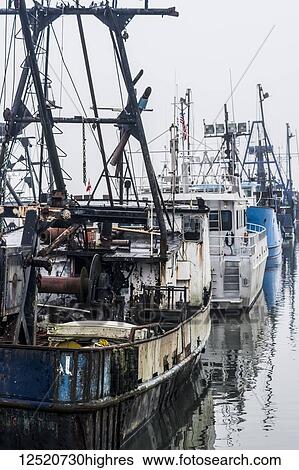 Stock Photograph - Commercial fishing boats rest at the dock; Astoria, Oregon, United States of America. Fotosearch