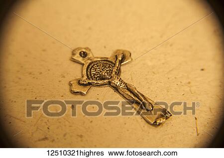 Stock Photograph - Crucifix on a gold cross. Fotosearch
