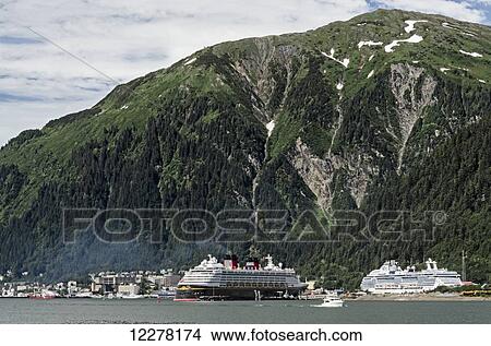 Cruise ships moored at the docks at Juneau, Gastineau Channel, Southeast Alaska View Large Photo Image Picture - Cruise ships moored at the docks at Juneau, Gastineau Channel, Southeast Alaska. Fotosearch