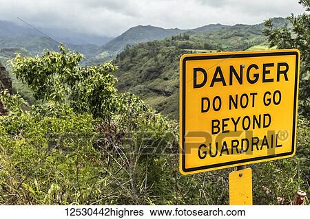 Stock Photograph - Danger sign at Hanapepe Valley and Canyon Lookout on Kaumualii Highway (Mile 14), also known as Hawaii State Route 50; Kauai, Hawaii, United States of America. Fotosearch