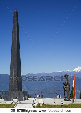Stock Photograph - Darjeeling Toy Train stop and war memorial, The Darjeeling Himalayan Railway; Darjeeling, West Bengal, India. Fotosearch