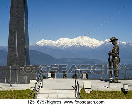 Stock Photograph - Darjeeling Toy Train stop and war memorial, The Darjeeling Himalayan Railway; Darjeeling, West Bengal, India. Fotosearch