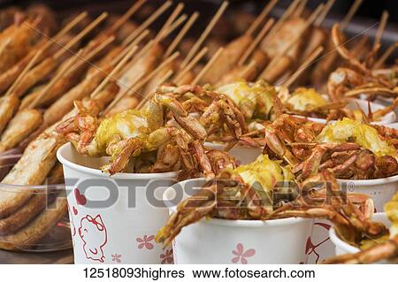Deep-fried seafood for sale on Kulangsu Island; Xiamen, Fujian, China View Large Photo Image Stock Photograph - Deep-fried seafood for sale on Kulangsu Island; Xiamen, Fujian, China. Fotosearch