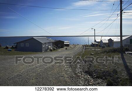 Stock Image - Dirt road to waterfront; Cambridge Bay, Victoria Island, Nunavut, Canada. Fotosearch