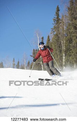 Stock Image - Downhill skier at Mt. Aurora Skiland near Cleary Summit north of Fairbanks, Alaska. Fotosearch