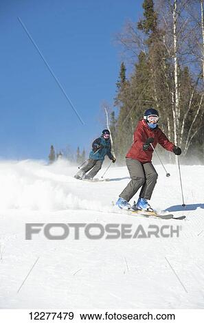 Stock Photo - Downhill skiers at Mt. Aurora Skiland near Cleary Summit north of Fairbanks, Alaska. Fotosearch