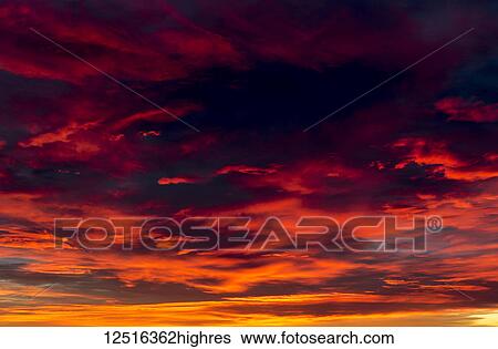 Stock Photograph - Dramatic colourful cloud formations at sunset; Calgary, Alberta, Canada. Fotosearch
