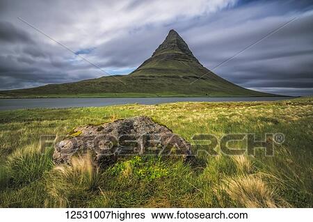 Dramatic long exposure over Kirkjufell, the most photographed mountain in Iceland, Snaefellsness Peninsula; Iceland View Large Photo Image Stock Photograph - Dramatic long exposure over Kirkjufell, the most photographed mountain in Iceland, Snaefellsness Peninsula; Iceland. Fotosearch
