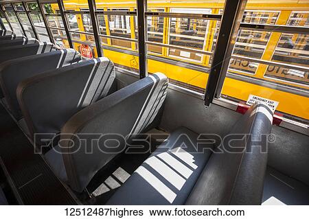 Empty seats in a school bus; Connecticut, United States of America View Large Photo Image Stock Photograph - Empty seats in a school bus; Connecticut, United States of America. Fotosearch