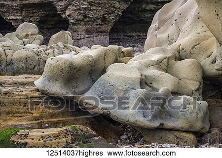 Stock Photograph - Erosion of rocks on the coast at Whitburn, North East England; Whitburn, Tyne and Wear, England. Fotosearch