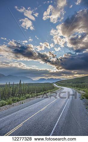 Evening sunset view of the Alaska Highway near Kluane Lake, Yukon Territory, Canada, HDR View Large Photo Image Stock Photo - Evening sunset view of the Alaska Highway near Kluane Lake, Yukon Territory, Canada, HDR. Fotosearch