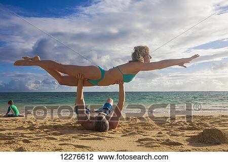 Family playing on the beach; Kailua, Island of Hawaii, Hawaii, United States of America View Large Photo Image Stock Image - Family playing on the beach; Kailua, Island of Hawaii, Hawaii, United States of America. Fotosearch