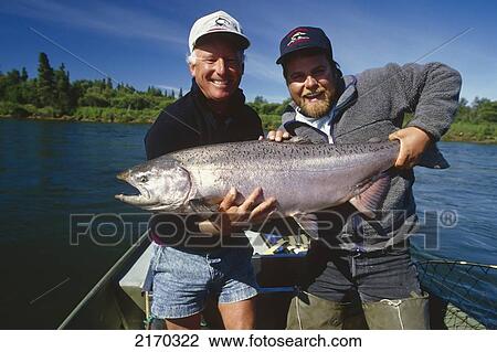 Fisherman & Guide Holding Large King Salmon In Boat Nushagak River Southwest Ak Summer View Large Photo Image Stock Image - Fisherman & Guide Holding Large King Salmon In Boat Nushagak River Southwest Ak Summer. Fotosearch