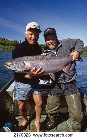 Fisherman & Guide Holding Large King Salmon In Boat Nushagak River Southwest Ak Summer View Large Photo Image Stock Image - Fisherman & Guide Holding Large King Salmon In Boat Nushagak River Southwest Ak Summer. Fotosearch