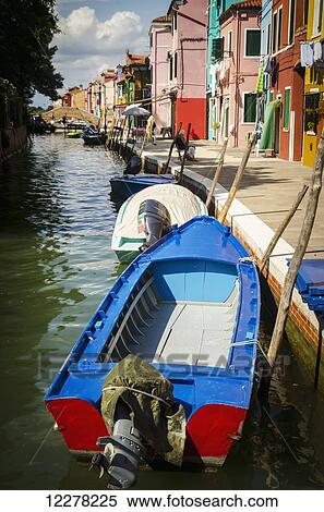 Stock Photography - Fishing boats line the canal; Burano, Venice. Fotosearch
