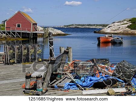 Fishing supplies in a pile on a wooden dock in a harbour near Peggy's Cove; Nova Scotia, Canada View Large Photo Image Stock Photograph - Fishing supplies in a pile on a wooden dock in a harbour near Peggy's Cove; Nova Scotia, Canada. Fotosearch