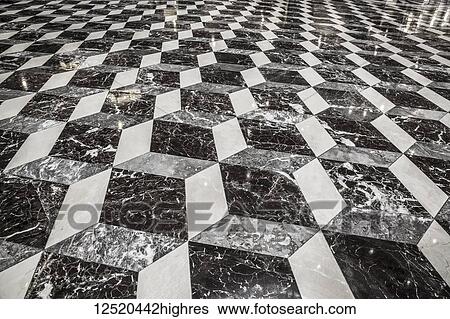 Stock Photograph - Floor of an office building that looks three-dimensional in a geometric pattern of black and white; Connecticut, United States of America. Fotosearch