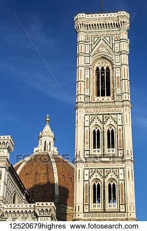 Florence Cathedral bell tower warmly lit at sunset with blue sky; Florence, Tuscany, Italy View Large Photo Image Stock Photograph - Florence Cathedral bell tower warmly lit at sunset with blue sky; Florence, Tuscany, Italy. Fotosearch