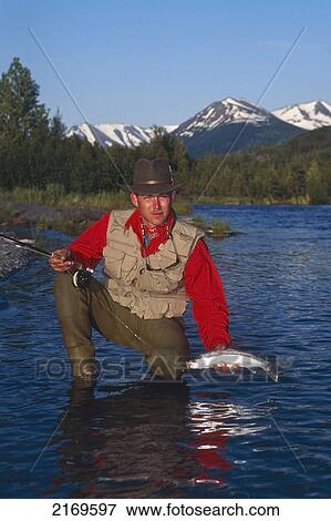 Flyfisherman Holding Rainbow Trout Kenai River Kenai Peninsula Alaska Summer Portrait View Large Photo Image Stock Photo - Flyfisherman Holding Rainbow Trout Kenai River Kenai Peninsula Alaska Summer Portrait. Fotosearch