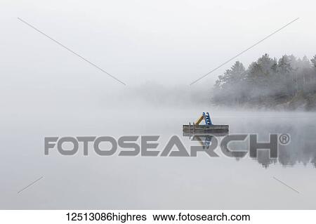 Fog shrouds a small island on Turtle Lake in Ontarios Muskoka Region, near Rosseau; Ontario, Canada View Large Photo Image Stock Photograph - Fog shrouds a small island on Turtle Lake in Ontarios Muskoka Region, near Rosseau; Ontario, Canada. Fotosearch