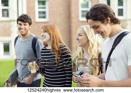 Four friends walking and talking together on the university campus; Edmonton, Alberta, Canada View Large Photo Image Stock Photograph - Four friends walking and talking together on the university campus; Edmonton, Alberta, Canada. Fotosearch