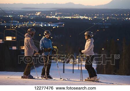 Friends at the top of Hilltop Ski Area at sunset in Anchorage, Alaska View Large Photo Image Stock Photograph - Friends at the top of Hilltop Ski Area at sunset in Anchorage, Alaska. Fotosearch