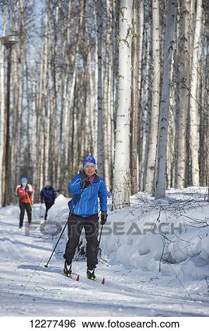 Friends enjoy nordic skiing on the Jim Whisenhant Cross Country Ski Trail system at Birch Hill Recreation Area in Fairbanks Alaska View Large Photo Image Stock Photograph - Friends enjoy nordic skiing on the Jim Whisenhant Cross Country Ski Trail system at Birch Hill Recreation Area in Fairbanks Alaska. Fotosearch