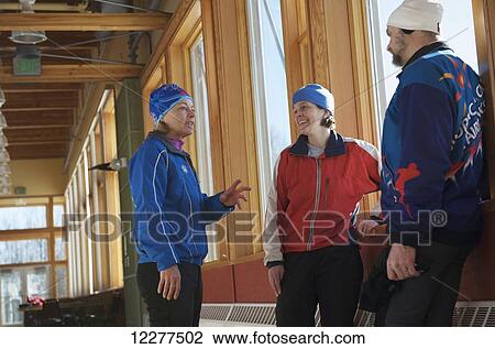 Stock Image - Friends meet at the Birch Hill Nordic Ski Center at Birch Hill Recreation Area in Fairbanks, Alaska. Fotosearch