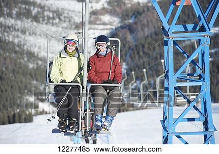 Friends ride the 3800-feet double chairlift at Mt. Aurora Skiland near Cleary Summit north of Fairbanks, Alaska. View Large Photo Image Stock Photography - Friends ride the 3800-feet double chairlift at Mt. Aurora Skiland near Cleary Summit north of Fairbanks, Alaska.. Fotosearch
