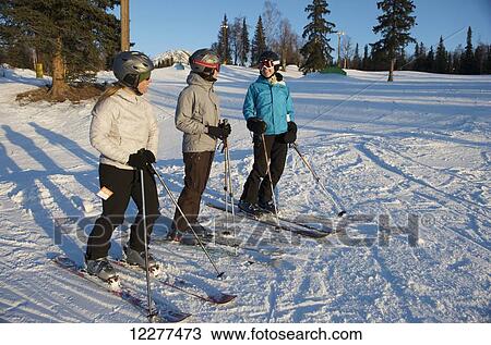 Friends skiing at Hilltop Ski Area in Anchorage, Alaska View Large Photo Image Stock Image - Friends skiing at Hilltop Ski Area in Anchorage, Alaska. Fotosearch