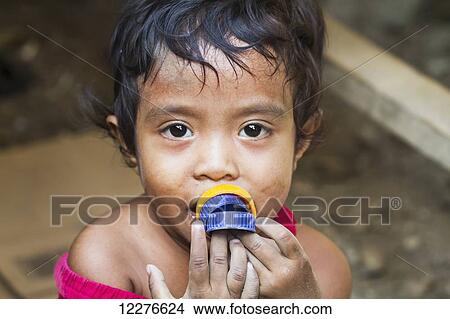Girl at the market; Dili, East Timor View Large Photo Image Picture - Girl at the market; Dili, East Timor. Fotosearch