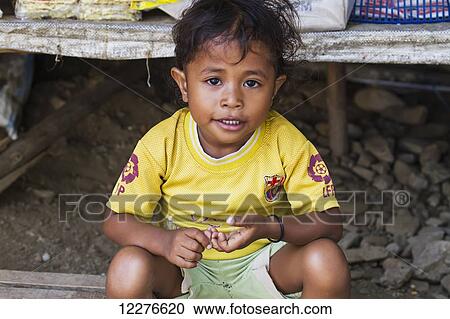 Girl at the market; Dili, East Timor View Large Photo Image Stock Image - Girl at the market; Dili, East Timor. Fotosearch