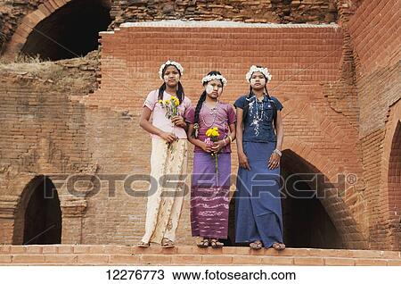 Girls posing with flowers and face paint; Bagan, Myanmar View Large Photo Image Stock Image - Girls posing with flowers and face paint; Bagan, Myanmar. Fotosearch