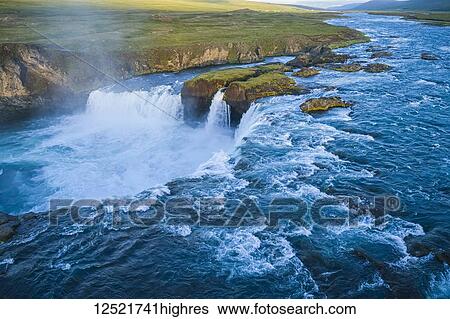 Stock Photograph - Godafoss, also known as 'Waterfalls of the gods', Northern Iceland; Iceland. Fotosearch