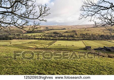 Stock Photograph - Green fields and distant hills of the Allen Valley; England. Fotosearch
