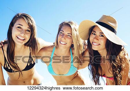 Stock Photograph - Group Of Attractive Girls Having Fun At The Beach. Best Friends, Summer Lifestyle.. Fotosearch
