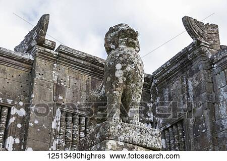 Stock Photograph - Guard lion sculpture at the entrance of Gopura II, Preah Vihear Temple; Preah Vihear, Cambodia. Fotosearch