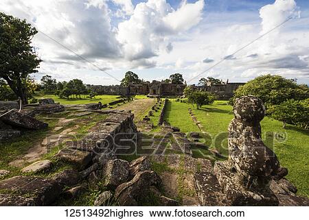 Stock Photograph - Guard lion sculpture at the entrance of Gopura II, Preah Vihear Temple; Preah Vihear, Cambodia. Fotosearch